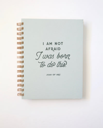 Joan of Arc Journal, with the words I am not afraid, I was born to do this on letterpress hard cover. Spiral bound for inspirational, motivational, journaling.